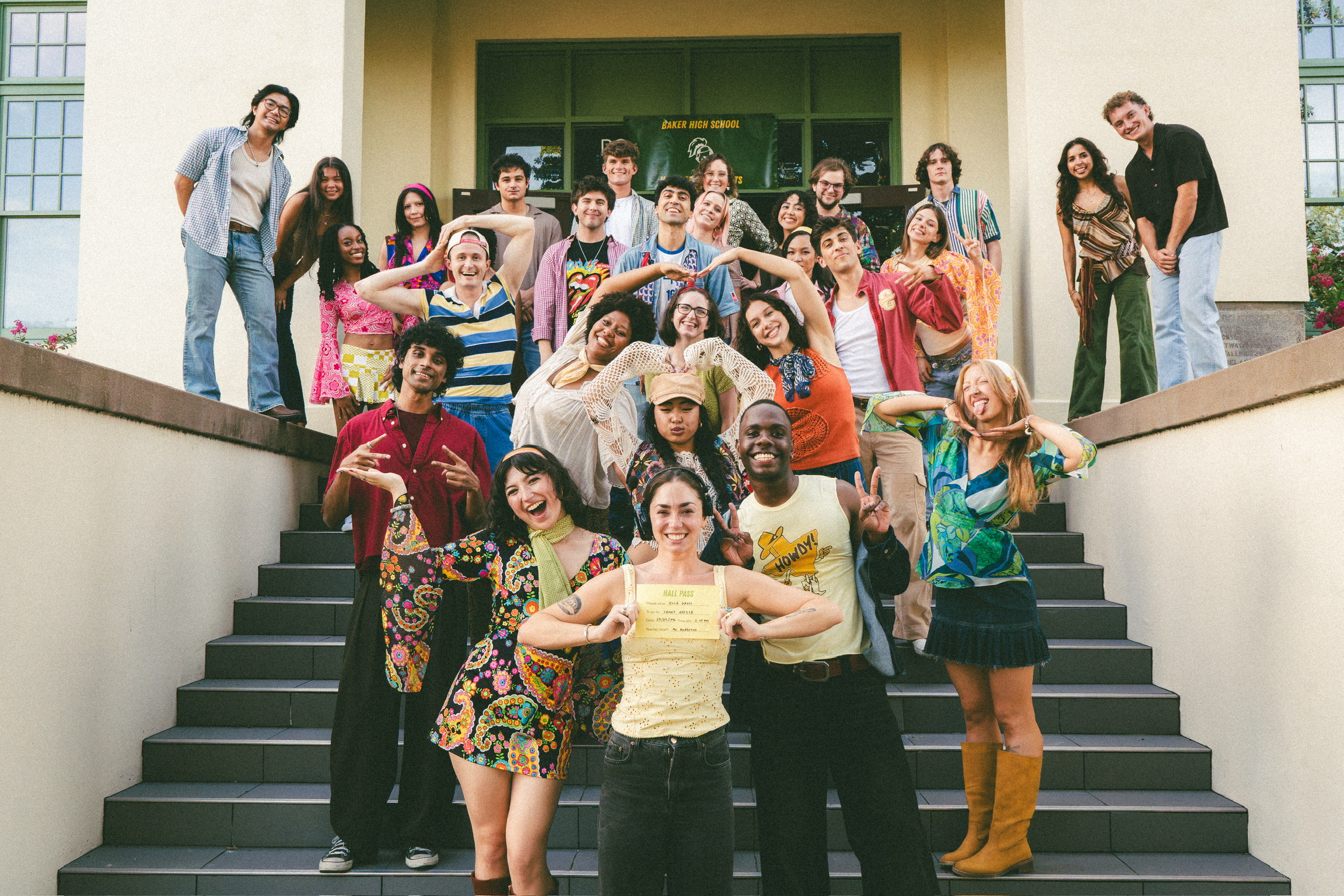 The full Hall Pass cast posing on the front steps of Baker High School