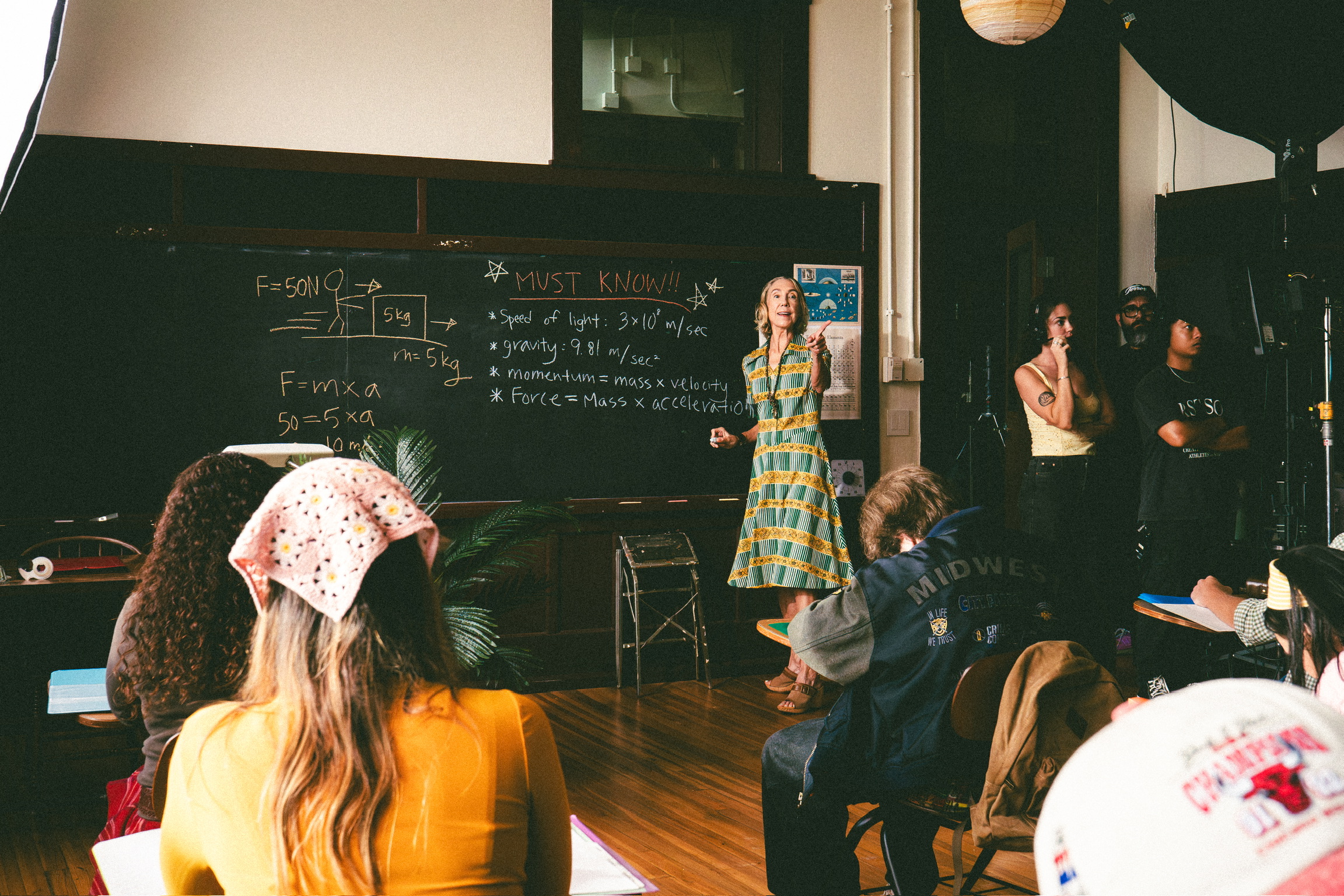 Filming the physics classroom scene with the teacher at the blackboard